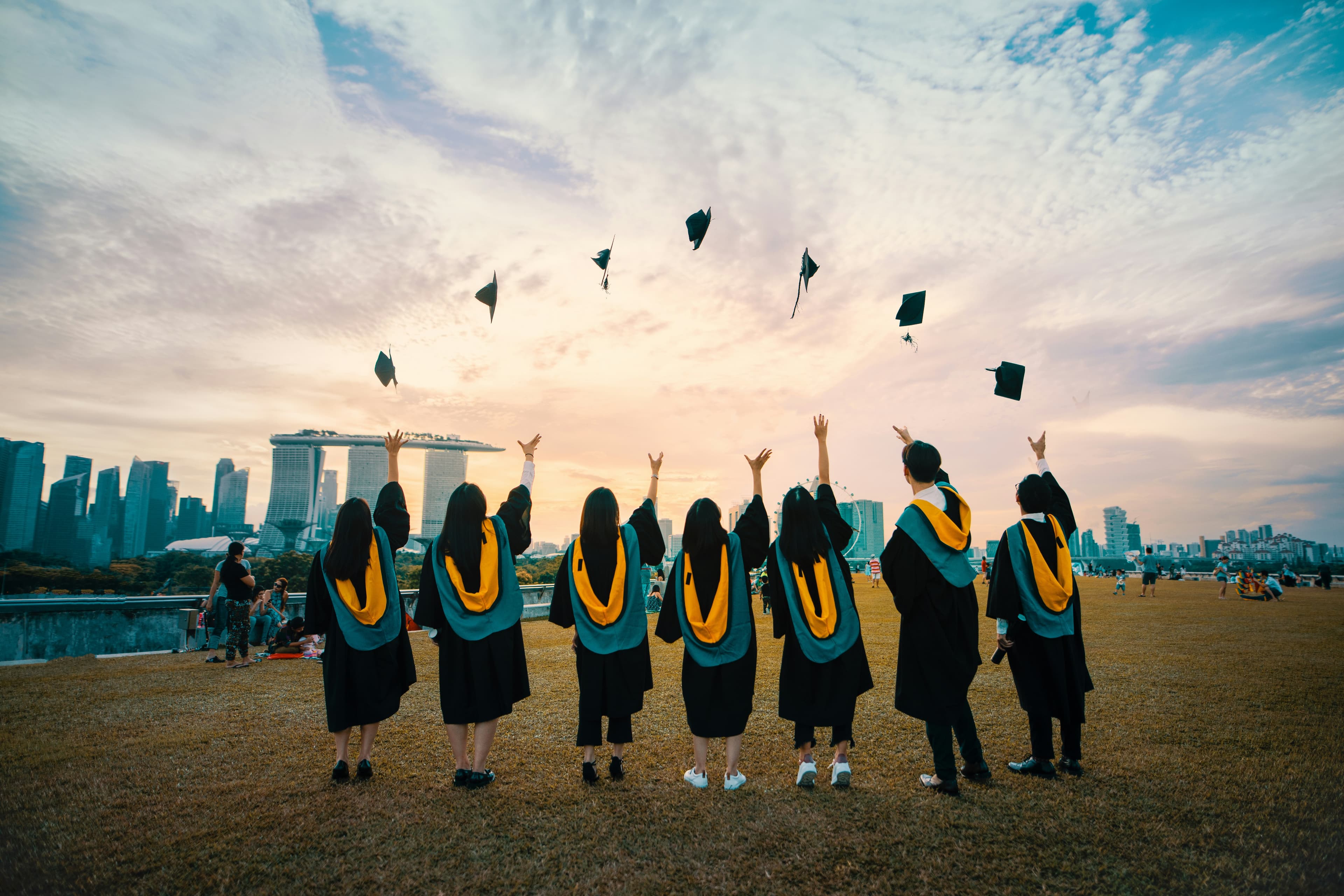 Graduate walking with diploma
